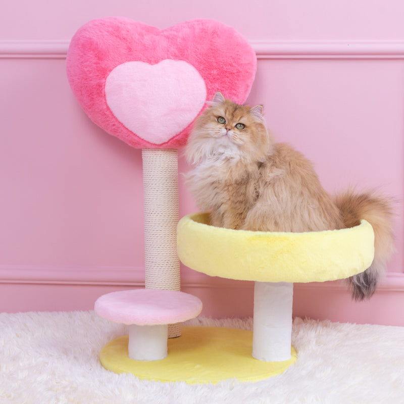 Cat sitting on the Hit Your Heart Cat Tree Yellow Platform.