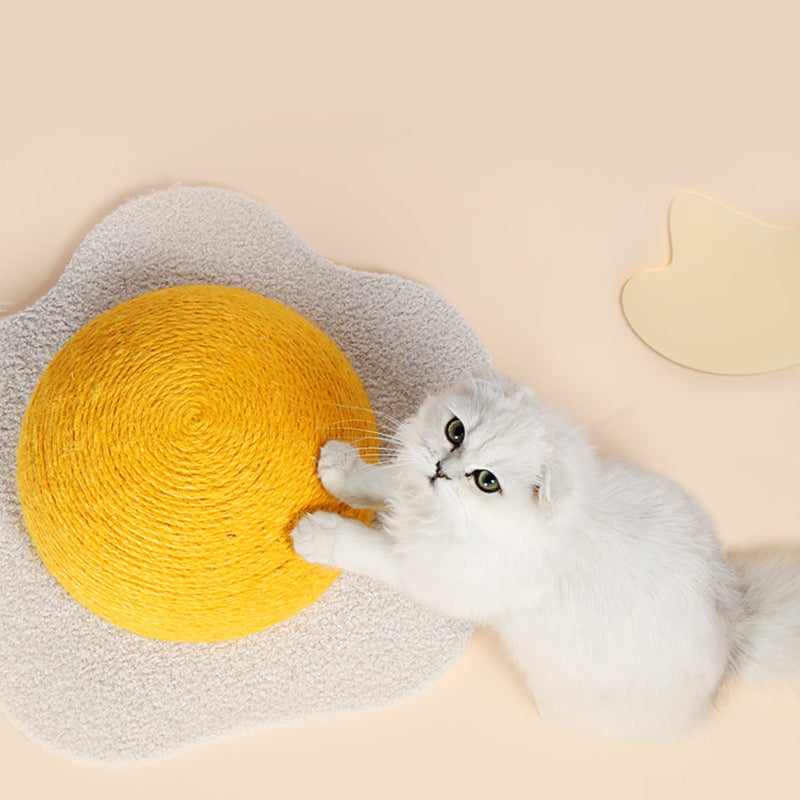 Top view of a cat scratching the Egg Series Cat Sisal Scratcher Toy, showing its ergonomic structure.