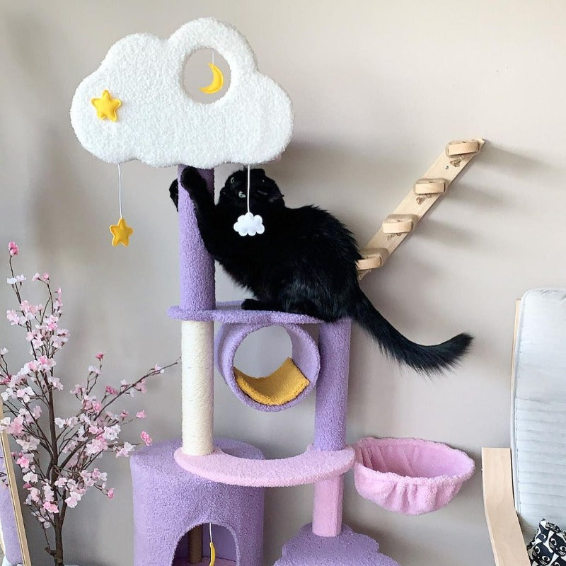 A black cat scratching on the Moonlight Cat Tree